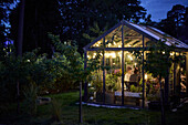 People having meal in greenhouse