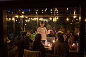 Friends having meal in greenhouse