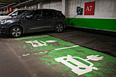 Electric car getting charged in garage