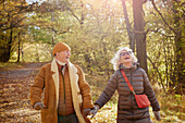 Happy senior couple in autumn park