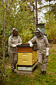 Bee-keepers posing during work