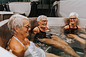 Happy female friends in spa