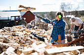 Mature woman working in sawmill