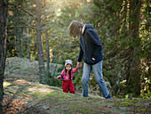 Father walking with toddler daughter