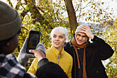 Smiling friends having their photo taken