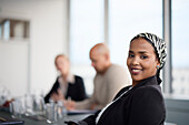 Smiling woman at business meeting