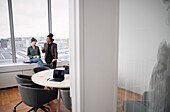 Business people having coffee break in office