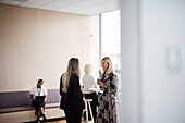 Businesswomen talking during coffee break