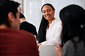 Smiling woman sitting at workshop