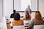 Woman giving presentation at seminar