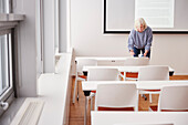 Woman standing in meeting room