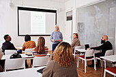 Woman giving presentation at seminar