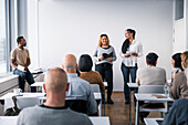 Women giving presentation at seminar
