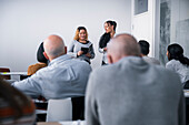 Women giving presentation at seminar