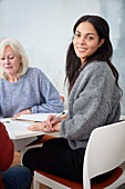 Smiling woman sitting at workshop