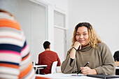 Portrait of smiling woman in class