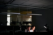 People working late in office