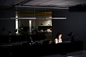 Woman working late in office