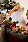 Woman decorating house for christmas