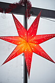 Close-up of illuminated red Christmas star