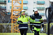 Construction engineers working at construction site
