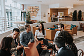 Smiling people talking during business meeting