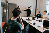 Man sitting during business meeting