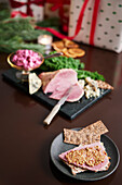 Christmas ham and presents on table