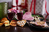 Christmas food and presents on table