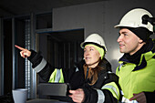 Engineers talking at building site