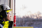 Engineer at building site looking away