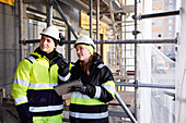 Engineers talking at building site