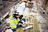 Engineers talking at building site