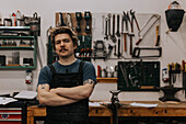 Portrait of blacksmith in workshop