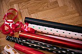 Various Christmas wrapping papers on floor