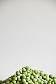 Heap of peas against gray background