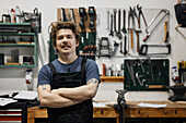 Blacksmith posing in his workshop