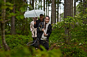 Friends walking through forest