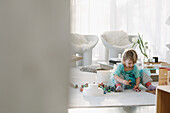 Girl playing on floor in living room