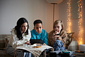 Children playing video games at home