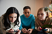 Children playing video games at home