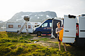 Woman standing in front of open van