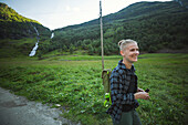 View of smiling woman hiking