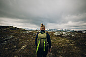 Rear view of hiker in mountains