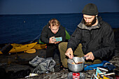 View of tourists camping at sea