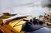 Sunglasses and hat on kayak