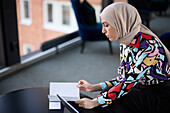 Businesswoman in hijab working in office