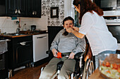 Mother with daughter in kitchen