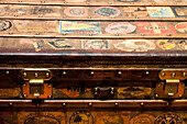 Old steamer trunk covered with stickers of various destinations.