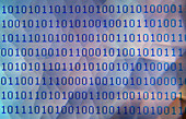 Binary numbers pixelated on computer screen with abstract background